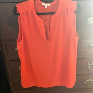 Orange sleeveless ladies blouse
